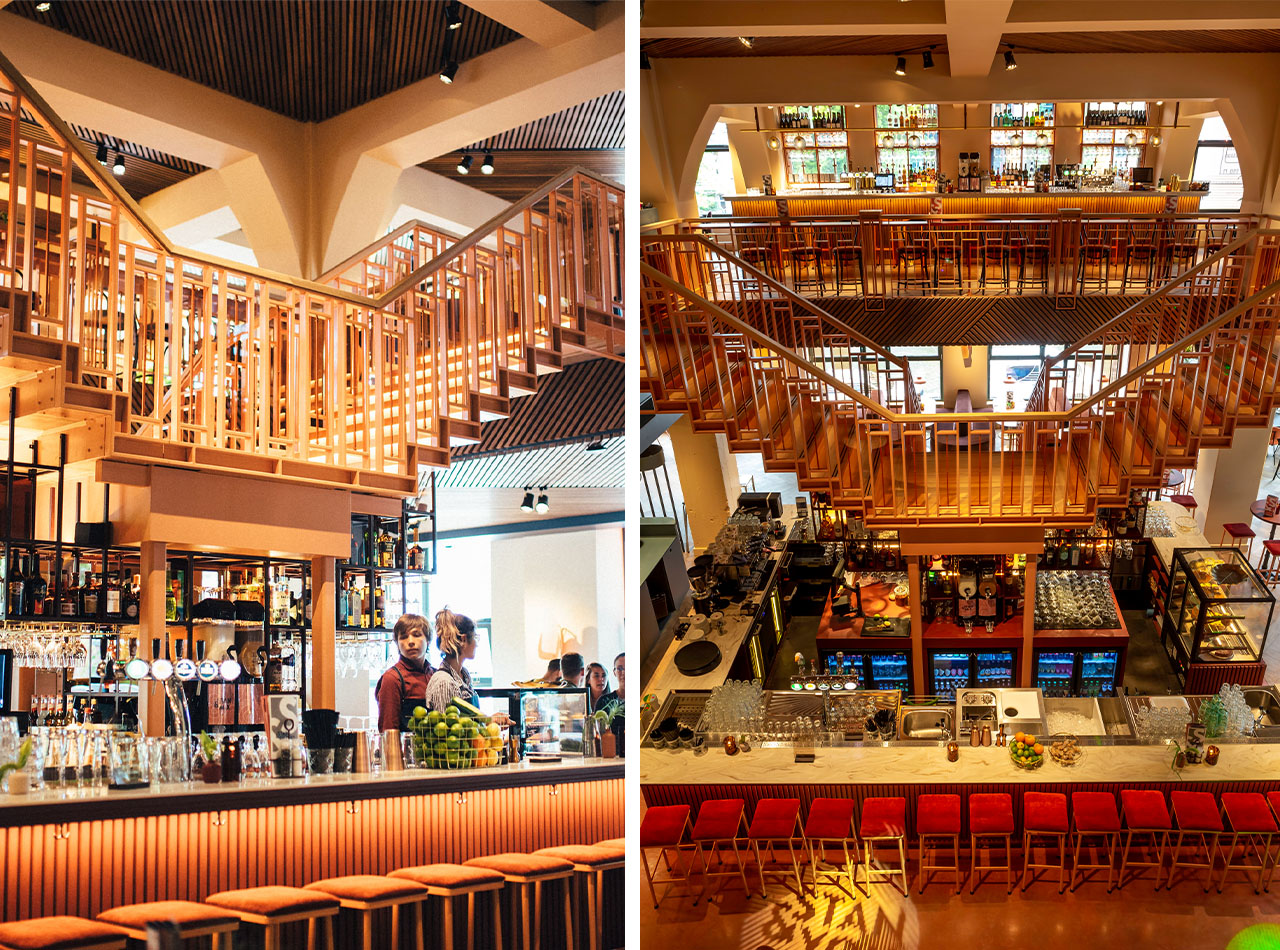 Houten trapconstructie en barinterieur en dubbele trap en barindeling met sfeervolle verlichting STAN & CO Amsterdam.